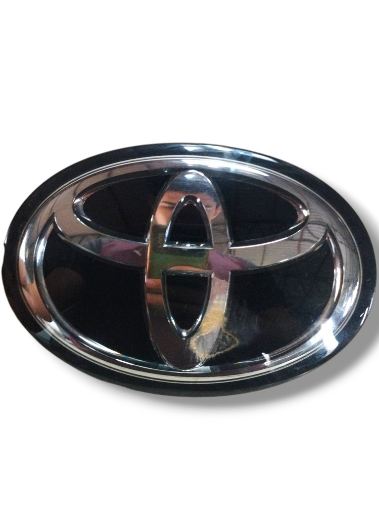 Emblema Toyota do Corolla Cross grade dianteira ORIGINAL